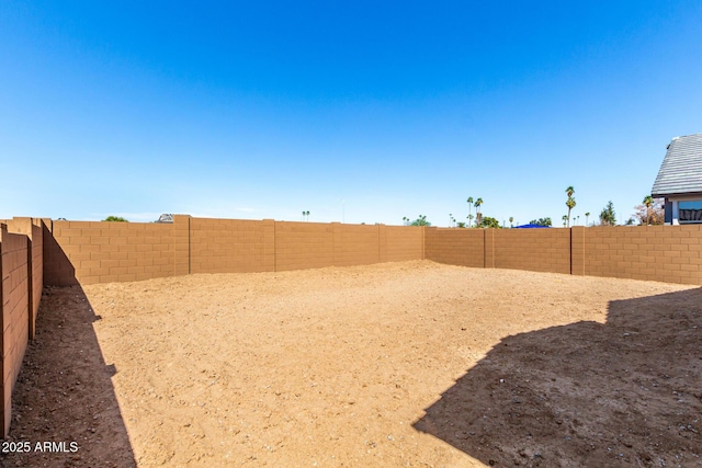 view of yard with a fenced backyard