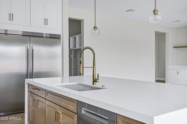 26655 S 169th Pl, Queen Creek, AZ 85142 - kitchen with a sink, pendant lighting, stainless steel appliances, light countertops, and visible vents