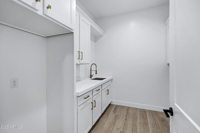 26655 S 169th Pl, Queen Creek, AZ 85142 - laundry room with light wood finished floors and a sink