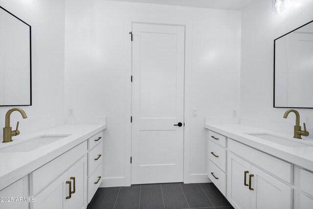26655 S 169th Pl, Queen Creek, AZ 85142 - bathroom with two vanities, tile patterned flooring, baseboards, and a sink