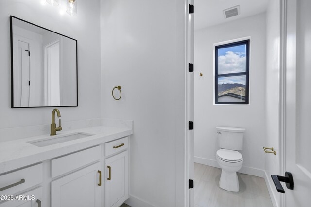26655 S 169th Pl, Queen Creek, AZ 85142 - bathroom with baseboards, visible vents, toilet, and vanity