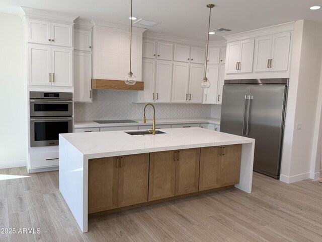 26655 S 169th Pl, Queen Creek, AZ 85142 - kitchen featuring tasteful backsplash, a sink, light wood-style flooring, appliances with stainless steel finishes, and recessed lighting