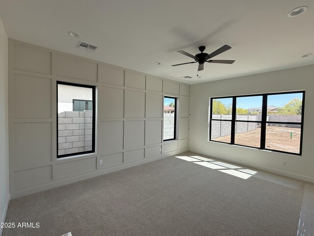 26655 S 169th Pl, Queen Creek, AZ 85142 - spare room with a decorative wall, visible vents, a ceiling fan, and carpet