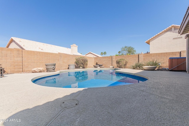 view of swimming pool with a patio, a fenced backyard, and a fenced in pool