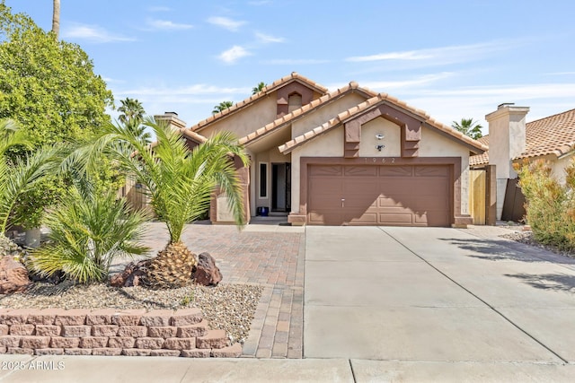 1962 E Morrow Dr, Phoenix, AZ 85024 - mediterranean / spanish home featuring driveway, a garage, and stucco siding