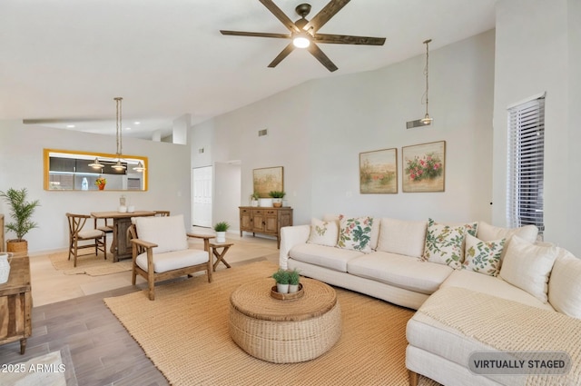 1962 E Morrow Dr, Phoenix, AZ 85024 - living room with high vaulted ceiling, a ceiling fan, and wood finished floors
