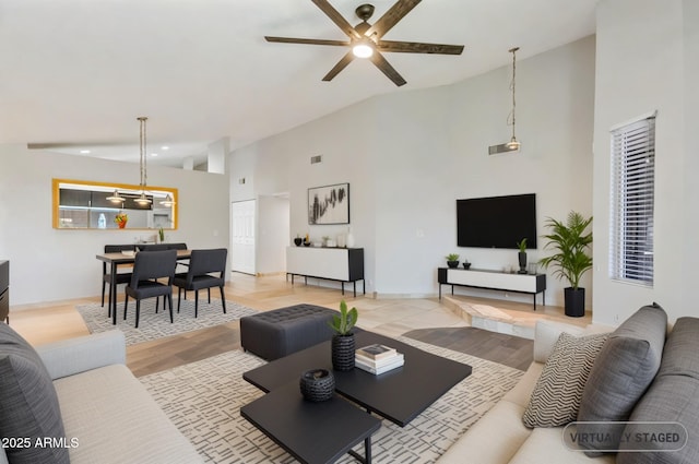 1962 E Morrow Dr, Phoenix, AZ 85024 - living room with ceiling fan, high vaulted ceiling, light wood-type flooring, baseboards, and recessed lighting