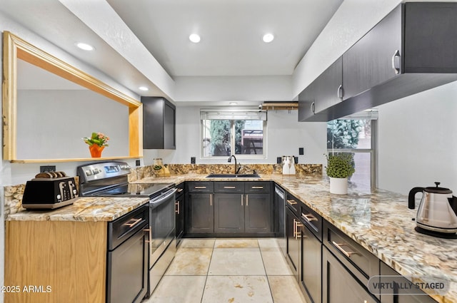 1962 E Morrow Dr, Phoenix, AZ 85024 - kitchen featuring stainless steel appliances, a sink, light stone counters, light tile patterned floors, and recessed lighting