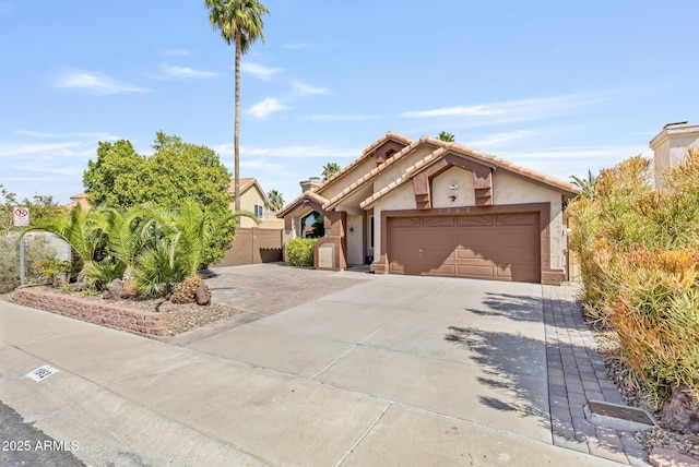 1962 E Morrow Dr, Phoenix, AZ 85024 - view of front of house with driveway, stucco siding, a garage, and a tile roof