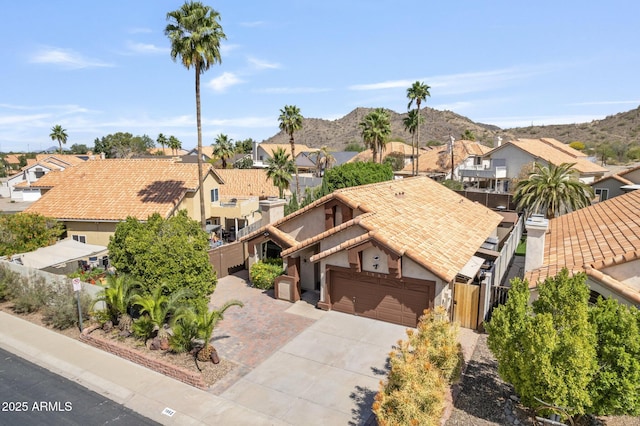 1962 E Morrow Dr, Phoenix, AZ 85024 - view of front of property featuring a residential view, a tiled roof, a mountain view, concrete driveway, and an attached garage