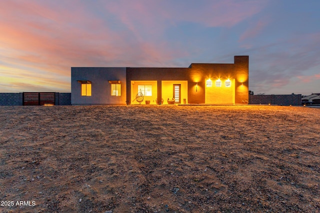935 Calle Azul, Wickenburg, AZ 85390 - back of house at dusk with fence