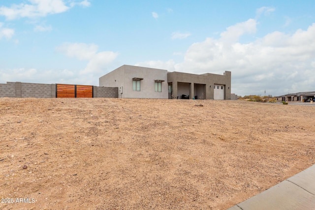 935 Calle Azul, Wickenburg, AZ 85390 - view of front of house with fence and stucco siding