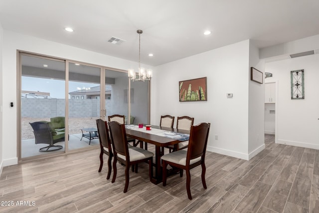 935 Calle Azul, Wickenburg, AZ 85390 - dining room featuring visible vents, light wood-style flooring, baseboards, and an inviting chandelier