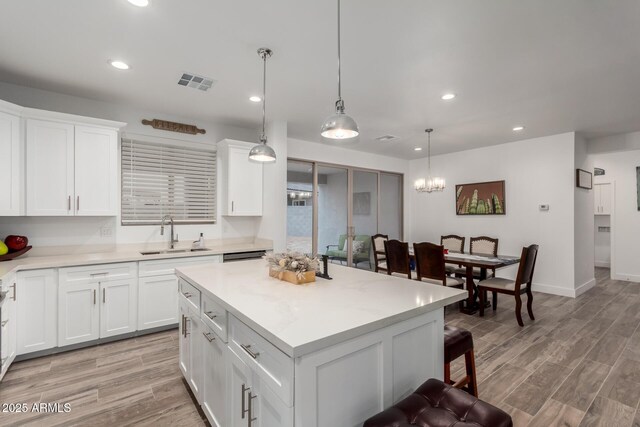935 Calle Azul, Wickenburg, AZ 85390 - kitchen with a sink, visible vents, light countertops, hanging light fixtures, and a center island