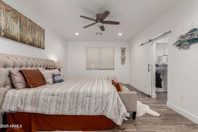 935 Calle Azul, Wickenburg, AZ 85390 - bedroom with recessed lighting, visible vents, a barn door, wood finished floors, and baseboards