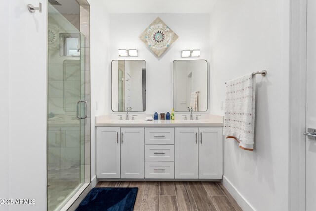935 Calle Azul, Wickenburg, AZ 85390 - full bathroom featuring double vanity, a stall shower, a sink, and wood finished floors