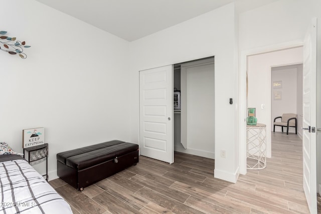 935 Calle Azul, Wickenburg, AZ 85390 - bedroom featuring a closet, baseboards, and wood finished floors