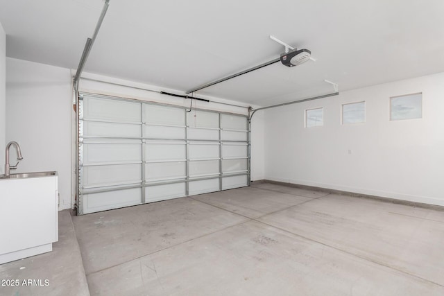 935 Calle Azul, Wickenburg, AZ 85390 - garage featuring baseboards, a sink, and a garage door opener
