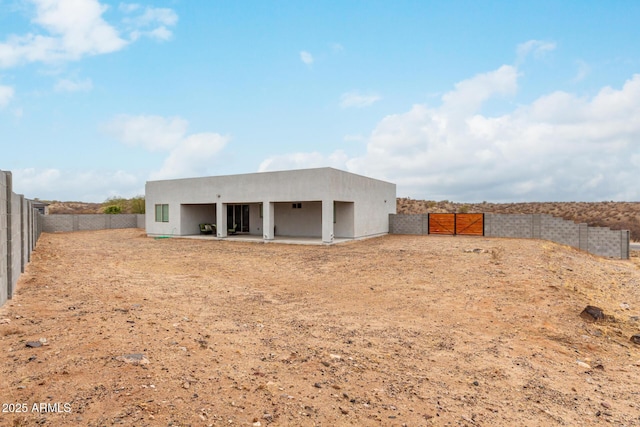 935 Calle Azul, Wickenburg, AZ 85390 - back of property with a patio area, a fenced backyard, and stucco siding
