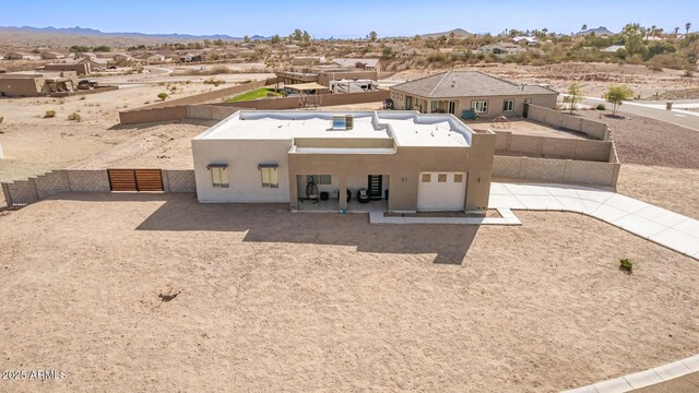 935 Calle Azul, Wickenburg, AZ 85390 - adobe home with a patio, fence private yard, a mountain view, and stucco siding