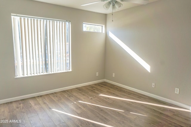 unfurnished room featuring ceiling fan and hardwood / wood-style floors