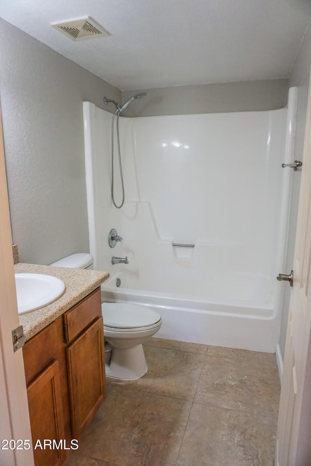 full bathroom with vanity, shower / bathtub combination, and toilet