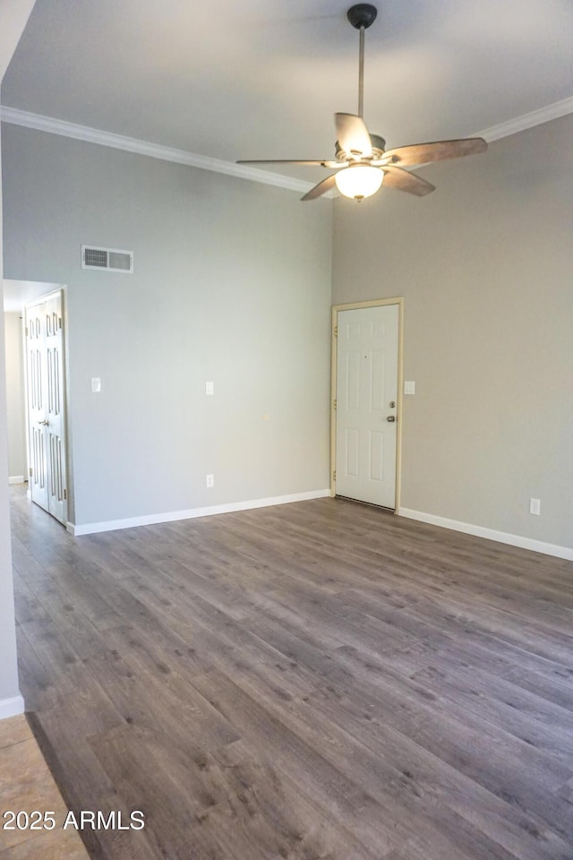 unfurnished room with dark hardwood / wood-style floors, ceiling fan, and crown molding