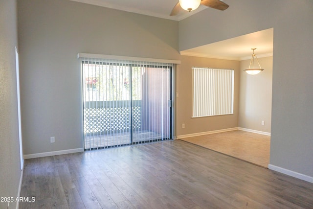 unfurnished room featuring crown molding, ceiling fan, and hardwood / wood-style flooring