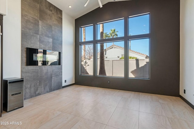 unfurnished room featuring vaulted ceiling