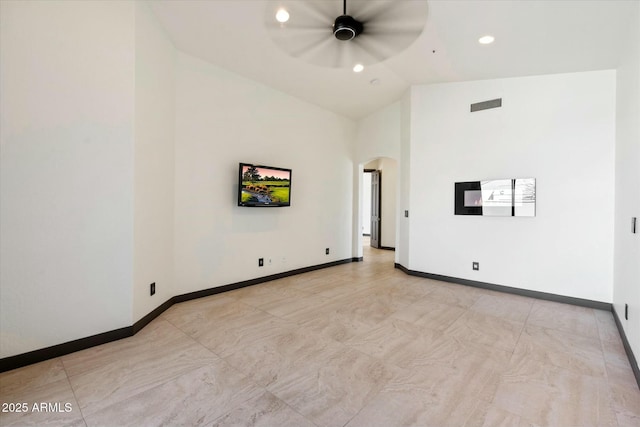 spare room featuring ceiling fan and high vaulted ceiling