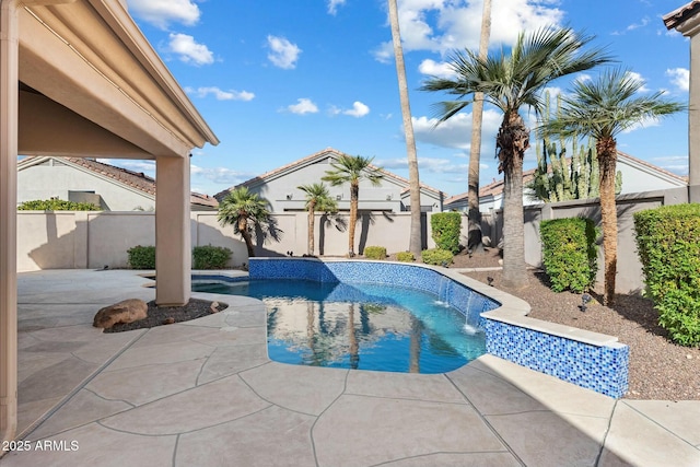 view of swimming pool featuring pool water feature and a patio area