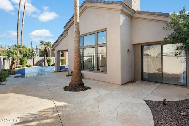 rear view of property with a patio area