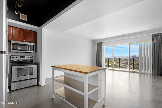 kitchen featuring concrete floors, visible vents, brown cabinetry, and stainless steel appliances