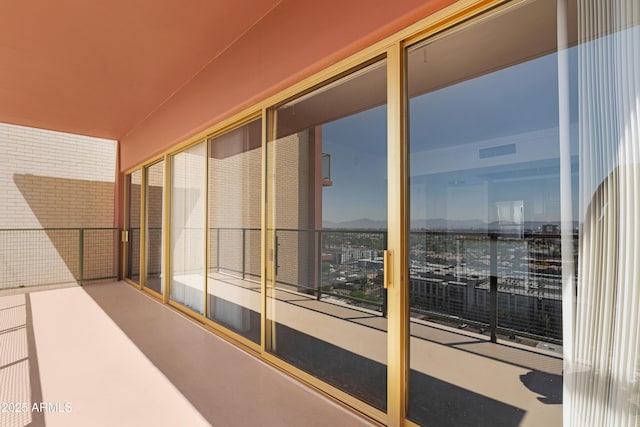 balcony featuring a mountain view and visible vents
