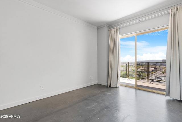 unfurnished room featuring finished concrete floors, baseboards, and plenty of natural light