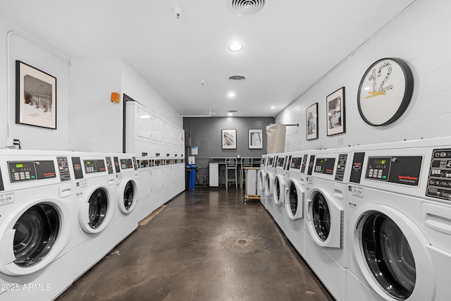 common laundry area featuring stacked washer / dryer, separate washer and dryer, visible vents, and recessed lighting