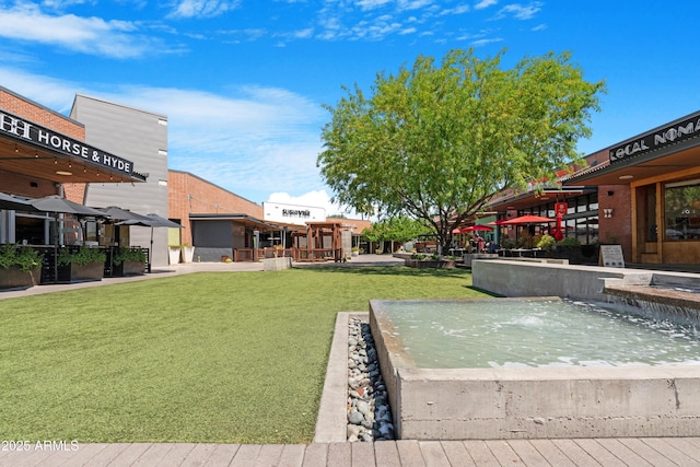 view of home's community featuring a lawn