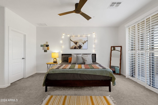 bedroom with ceiling fan and carpet