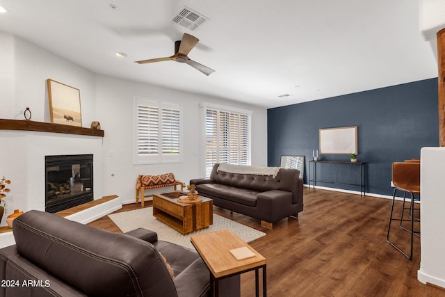 living room featuring ceiling fan and hardwood / wood-style floors