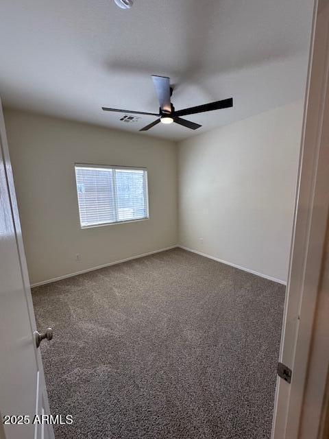 20985 N 81st Dr, Peoria, AZ 85382 - spare room with ceiling fan, carpet flooring, and baseboards