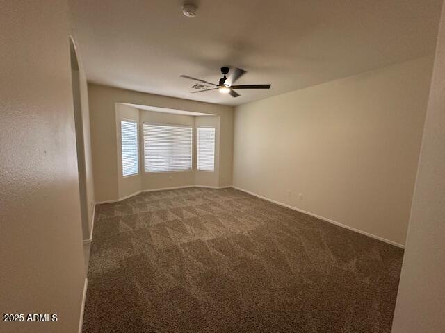20985 N 81st Dr, Peoria, AZ 85382 - carpeted spare room with a ceiling fan, a smoke detector, and baseboards