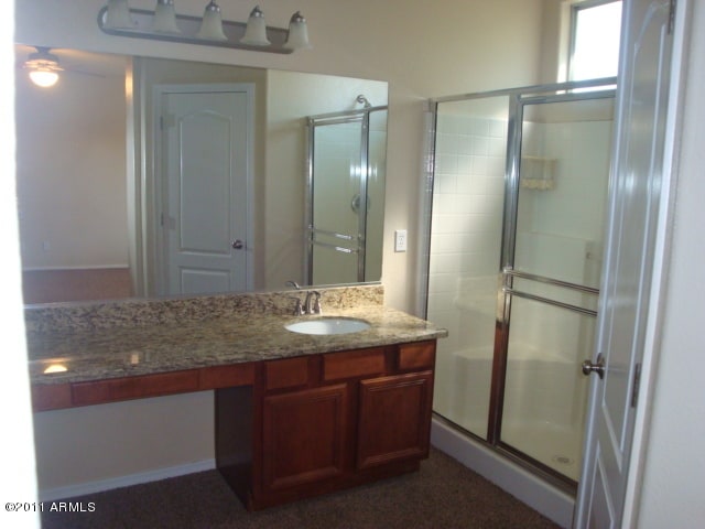 20985 N 81st Dr, Peoria, AZ 85382 - full bathroom featuring a shower stall, vanity, and a ceiling fan