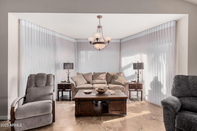 living room with an inviting chandelier