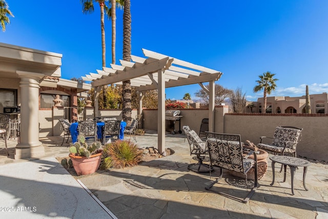 view of patio / terrace with an outdoor bar and a pergola