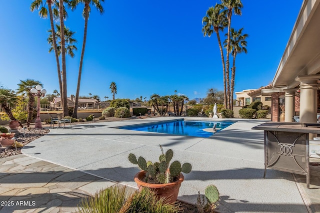 view of swimming pool with a patio