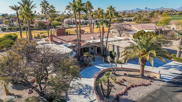 birds eye view of property with a mountain view