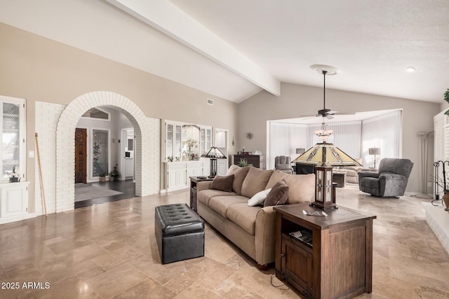 living room with lofted ceiling with beams and ceiling fan