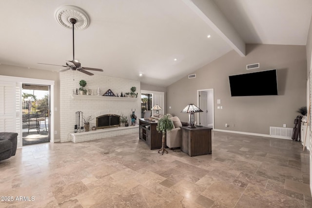 living room with beamed ceiling, ceiling fan, a brick fireplace, and high vaulted ceiling