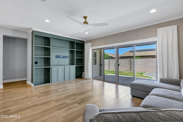 1272 W Joshua Tree Ave, Queen Creek, AZ 85140 - living area featuring light wood-type flooring, crown molding, recessed lighting, a ceiling fan, and baseboards