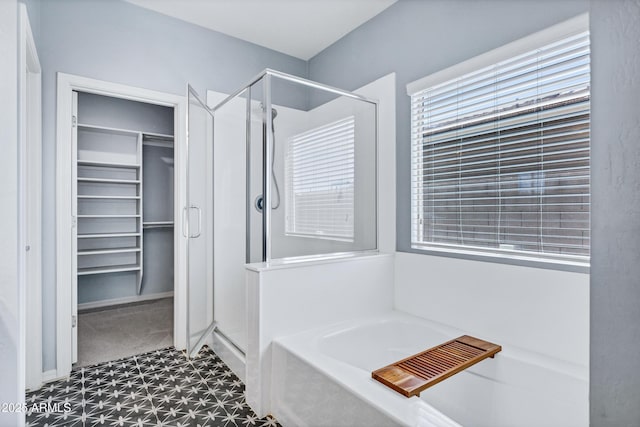 1272 W Joshua Tree Ave, Queen Creek, AZ 85140 - full bath with a shower stall, tile patterned floors, a walk in closet, and a garden tub